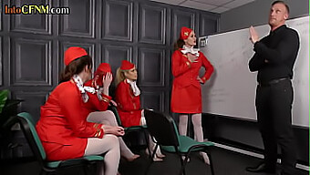 A Group Of Female Flight Attendants Pleasuring A Man'S Penis In A Bdsm Scene