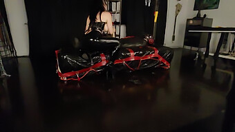 Latex Fetishist Uses Sex Toy To Spank And Stroke Cock